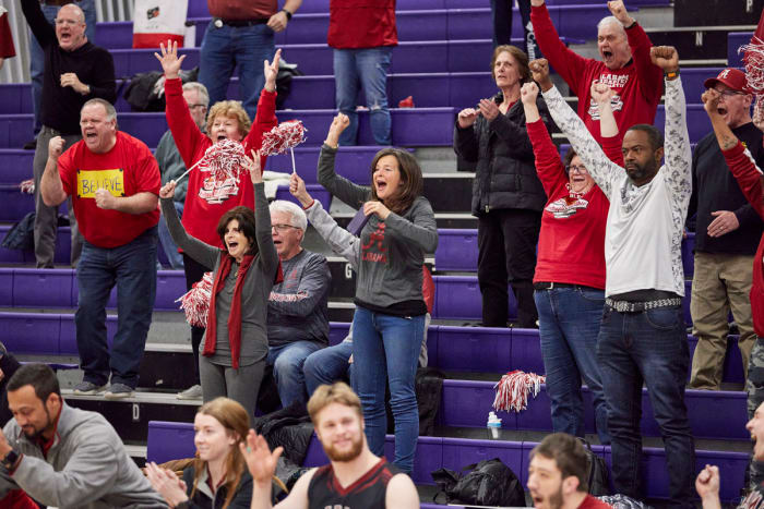 The Berry brothers’ aunt Simone (center, in gray “A” sweatshirt) cheered them on at the national championship game.